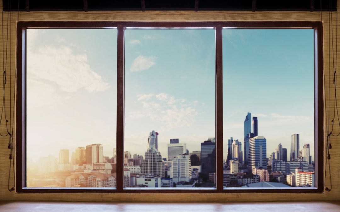 Modern windows with city view illustrating Southern California home heat control and energy savings.